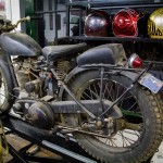 Vintage 1949 BSA motorcycle with sportster tank from Rob Schuff. Helmet art by Jeff Wolf.