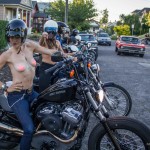 Michelle Clabby & Jenny Czinder say hello before riding topless through Portland with nipple pasties